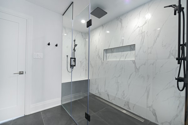 Modern bathroom with glass-enclosed shower